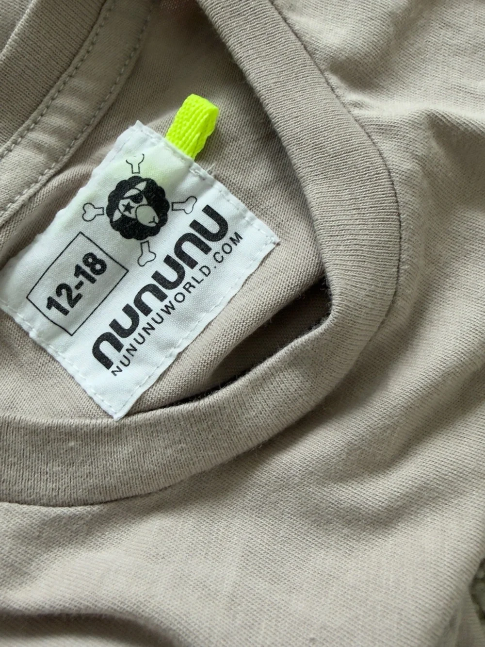 Nununu Beige Baby One-Piece with Skull Patch